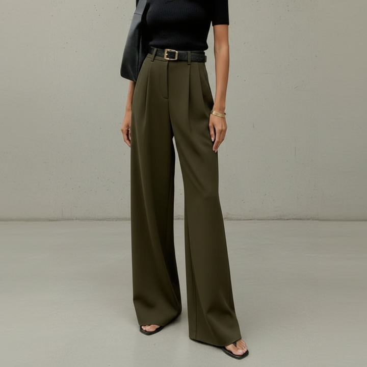 Calça feminina de perna larga combinada com blusa elegante, ideal para roupa de trabalho ou estilo casual chique.