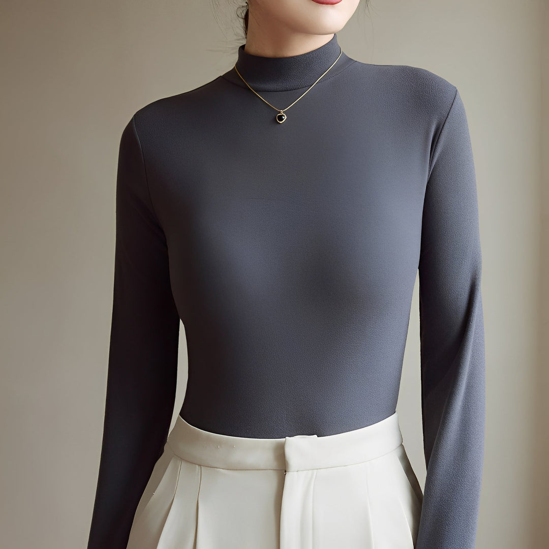 Roupa feminina gola alta elegante para look trabalho. Blusa confortável ideal para moda outono inverno.