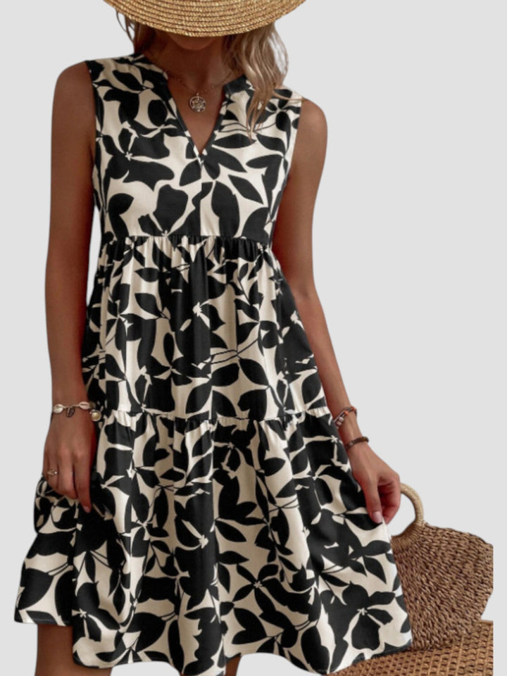 Moda feminina: Vestido midi de verão estampado com folhas. Confortável, leve e ideal para o calor.