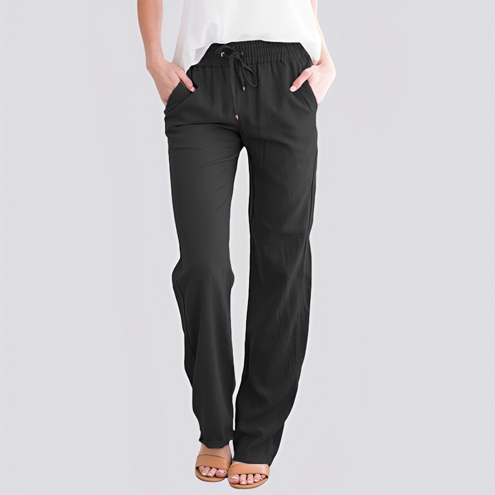 Calça casual feminina de caimento solto e cós elástico, proporcionando conforto e um look moderno.