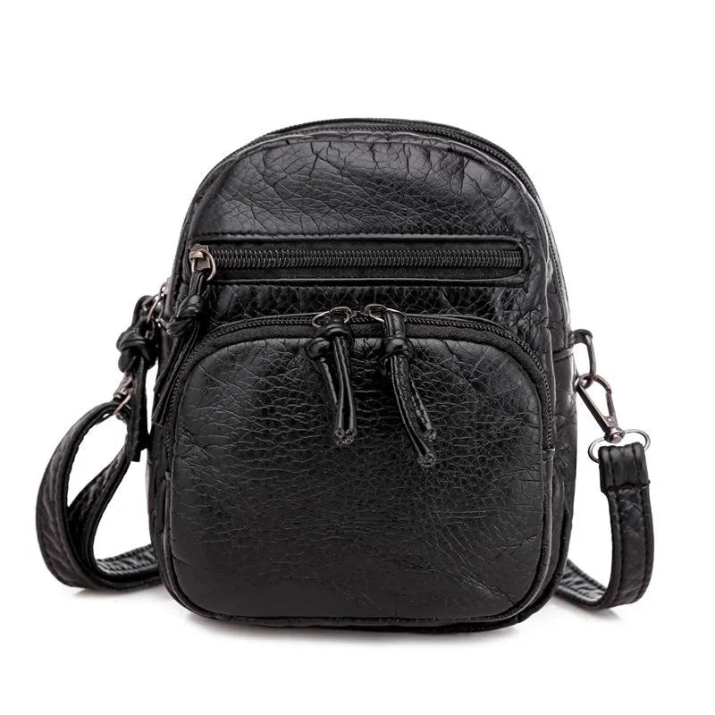 Mala de ombro de pele macia preta, design feminino e casual para conforto e elegância.