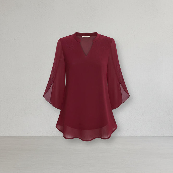 Blusa feminina Brianna com mangas abertas para um visual elegante de verão ou casual chique.