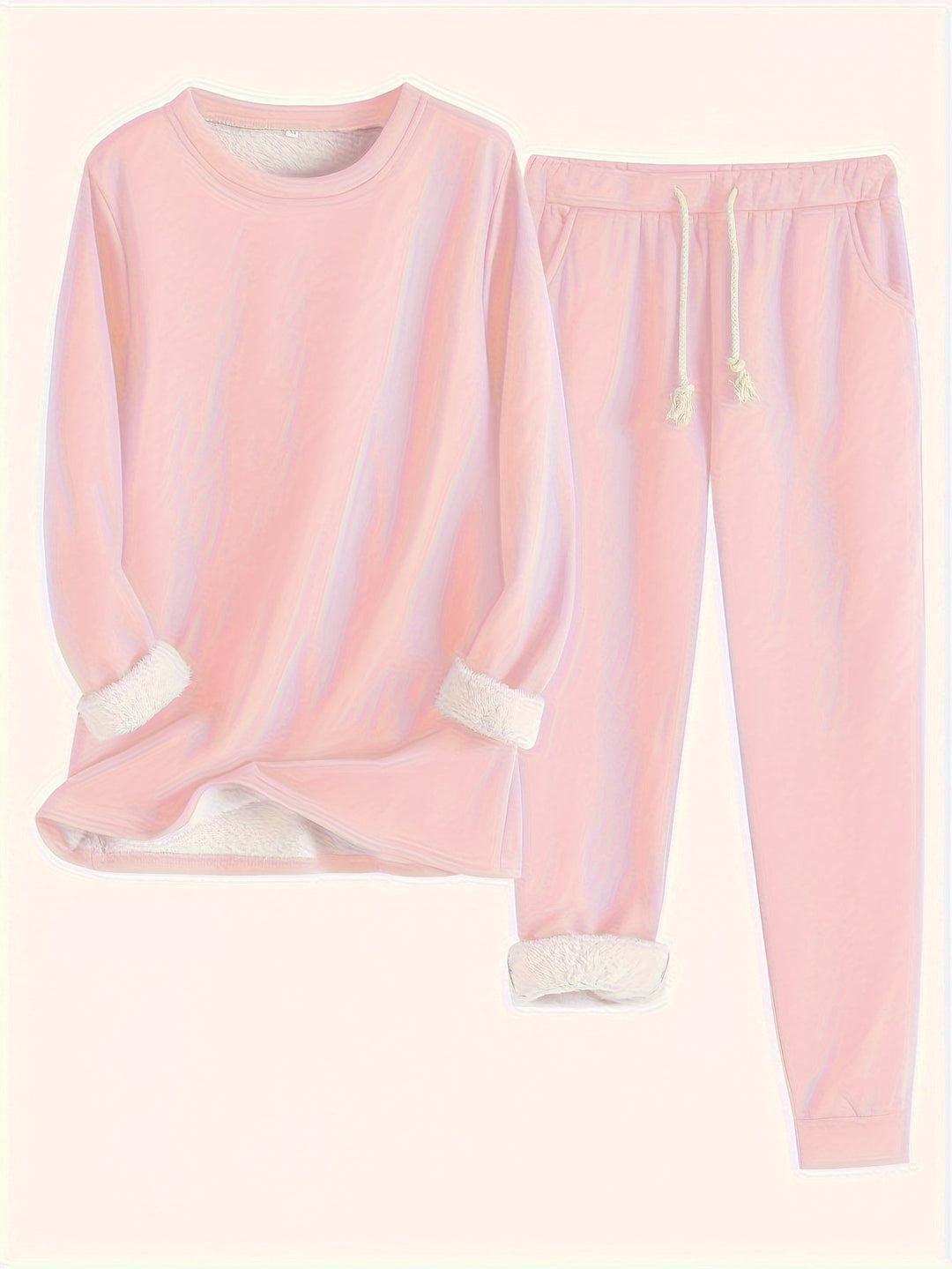 Conjunto de moletom e calça jogger feminino em cor neutra, versátil para looks casuais e relaxantes.