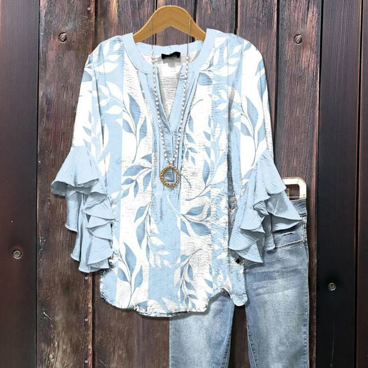 Blusa casual feminina floral para primavera e verão. Decote V e manga babado garantem conforto e estilo.