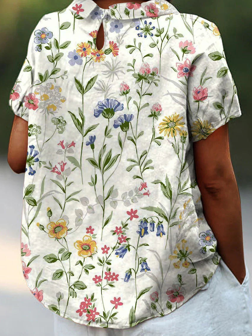 Camisa feminina com estampa floral retrô, estilo Camila. Confortável e elegante para looks de primavera-verão.