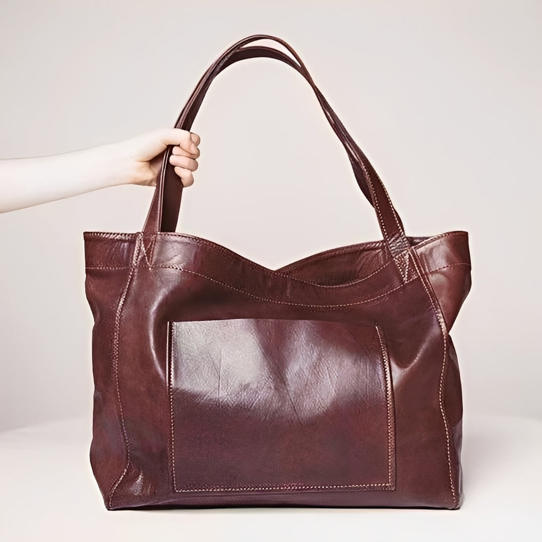 Grande bolsa de ombro feminina clássica, ideal para compor looks versáteis e elegantes com estilo.