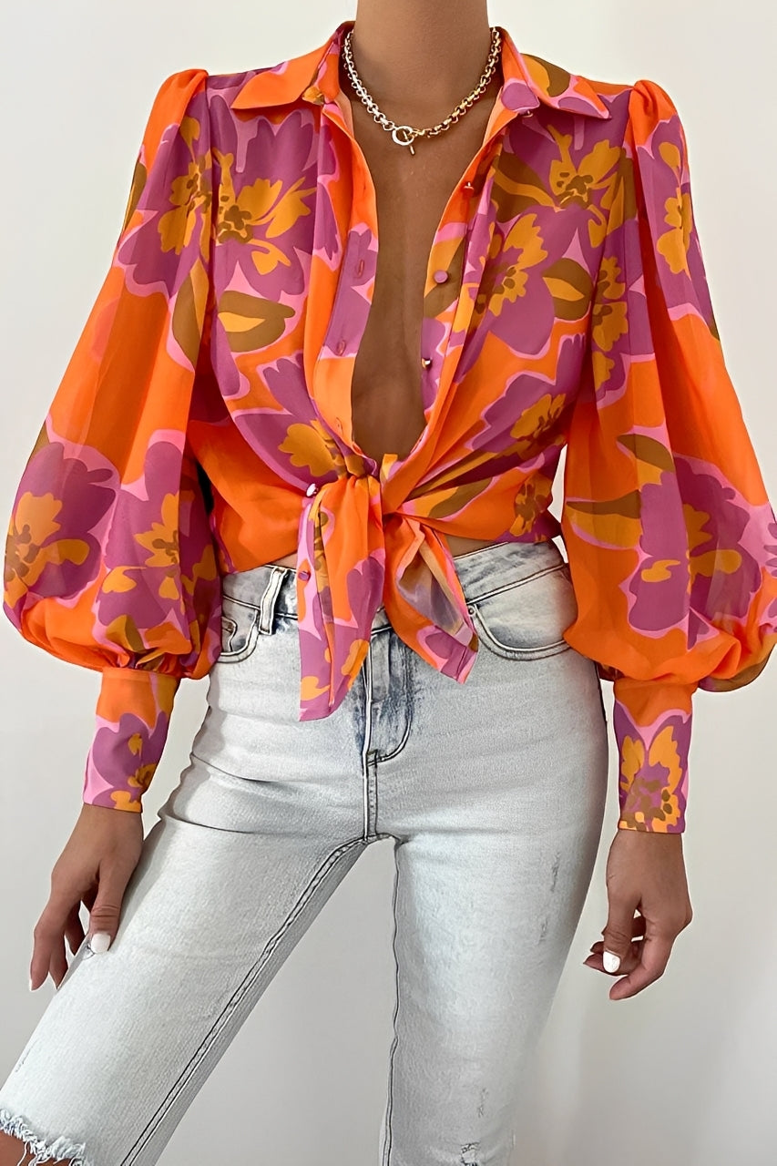 Blusa feminina elegante com mangas bufantes, ideal para o verão. Conforto e estilo casual chic.
