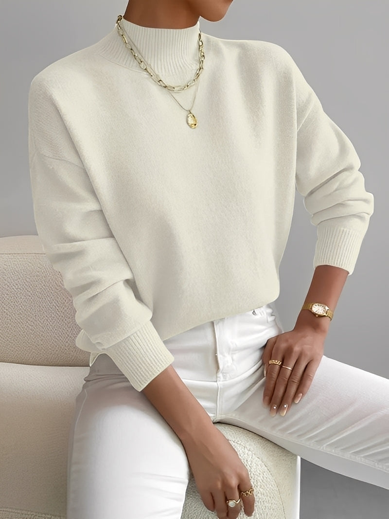 Camisola feminina elegante de gola alta, ideal para outono e inverno, combinando conforto e estilo versátil.