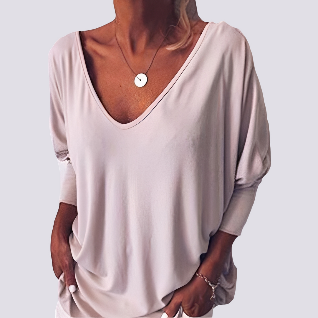Blusa feminina elegante com costas abotoadas, ideal para moda casual e versátil. Confortável para o verão.