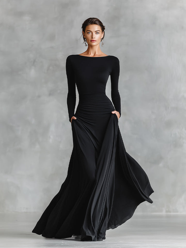 Vestido longo feminino preto com design elegante de pregas fluidas, moda para festas e jantares de gala.