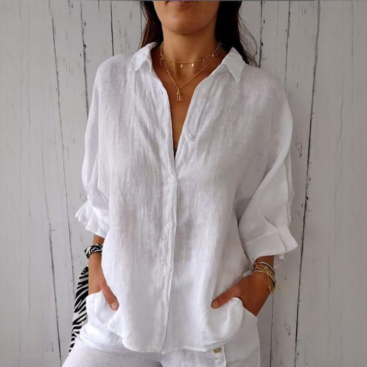 Camisa feminina casual Reena de manga comprida. Blusa confortável para o dia a dia com estilo descontraído.
