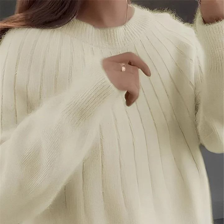 Suéter feminino elegante de malha. Ideal para o inverno, oferece conforto e estilo atemporal.