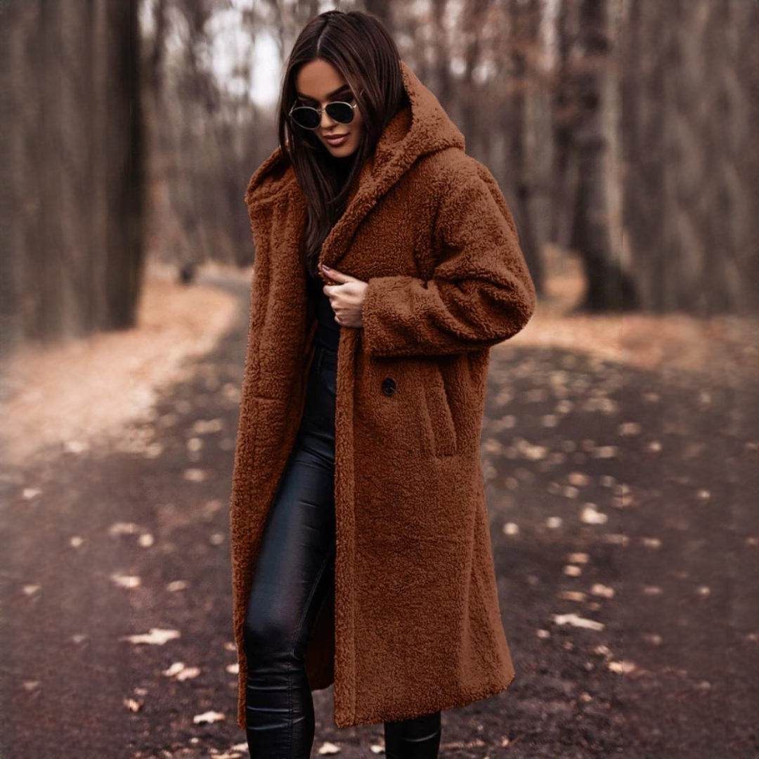 Casaco feminino longo elegante, com gola e caimento impecáveis. Ideal para o frio outono inverno. Conforto e tendência.