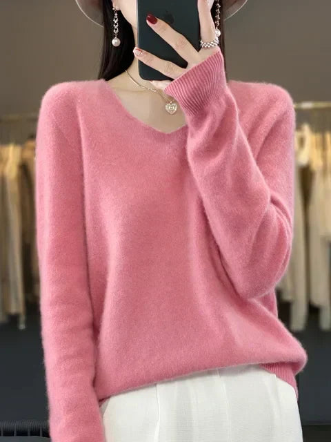 Blusa de malha folgada V-neck, design moderno e confortável para a mulher contemporânea.