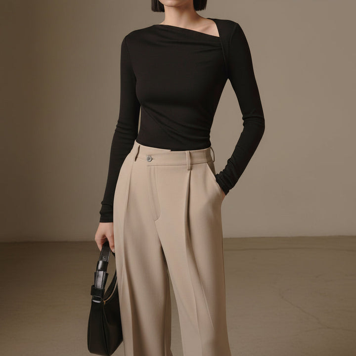 Blusa feminina manga longa assimétrica canelada, ideal para moda primavera outono. Elegância e conforto.