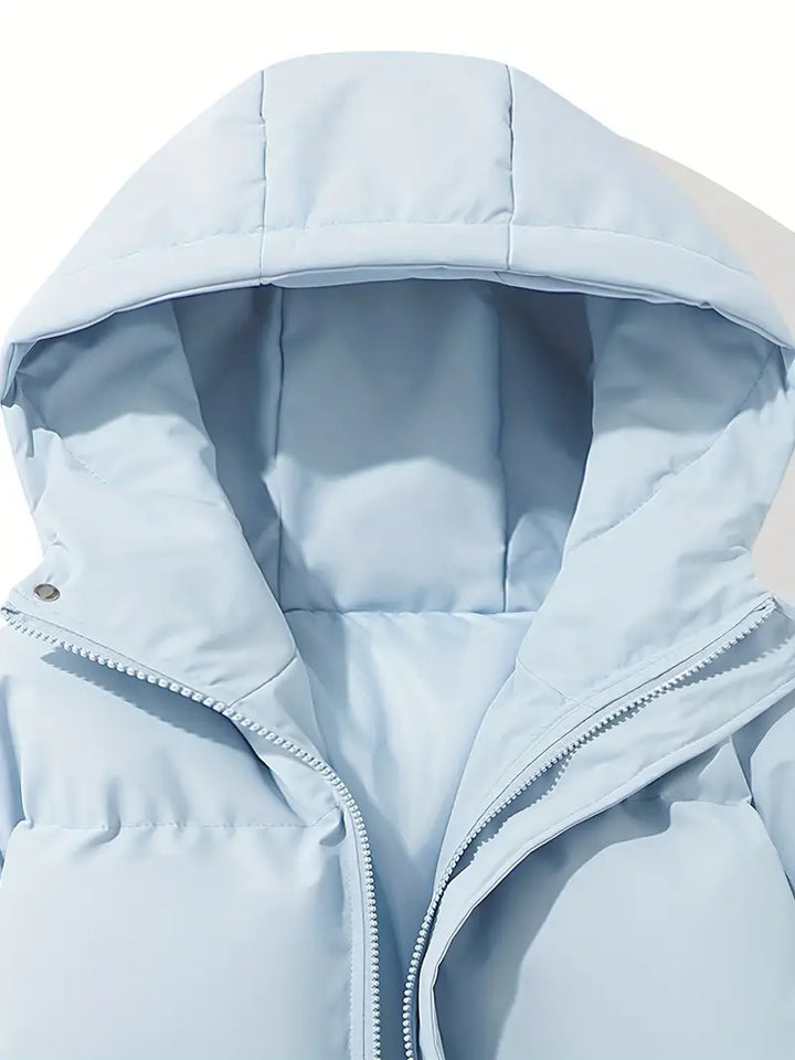 Jaqueta feminina acolchoada e quente, com capuz, para um inverno com estilo e proteção.