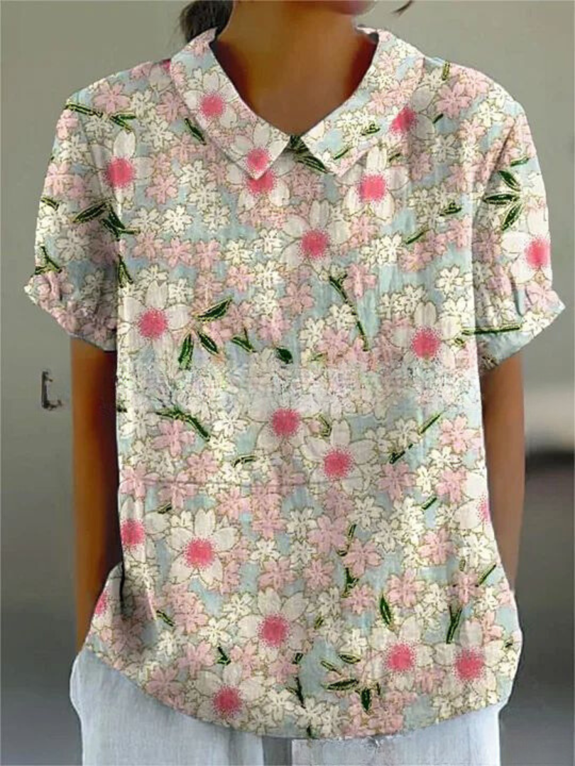 Camisa floral para mulher, estampa alegre e tecido leve. Perfeita para um estilo casual moderno.