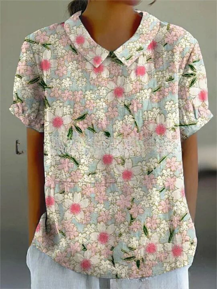 Camisa floral para mulher, estampa alegre e tecido leve. Perfeita para um estilo casual moderno.