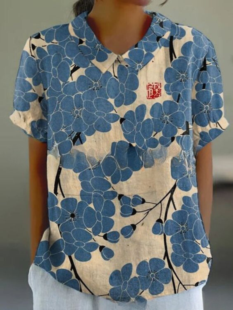 Camisa casual floral feminina, estampa vibrante. Confortável para o verão e primavera.
