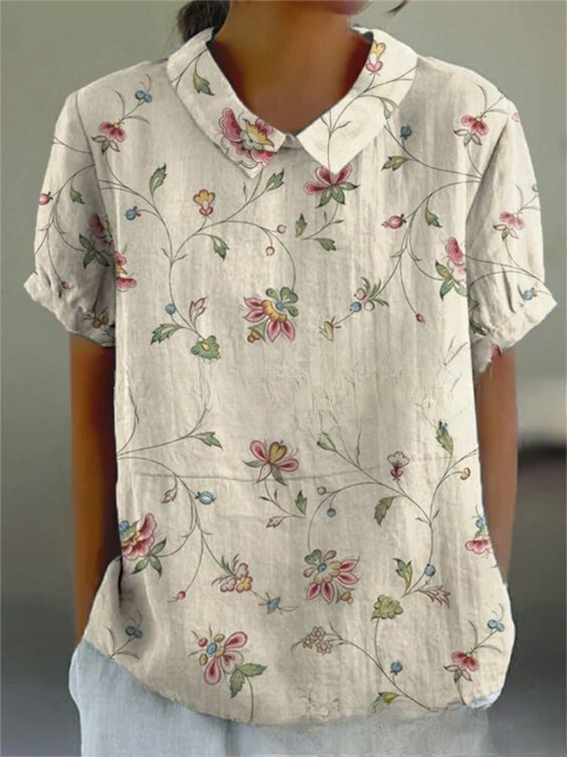 Camisa feminina com estampa floral, casual e elegante. Ideal para moda primavera-verão.