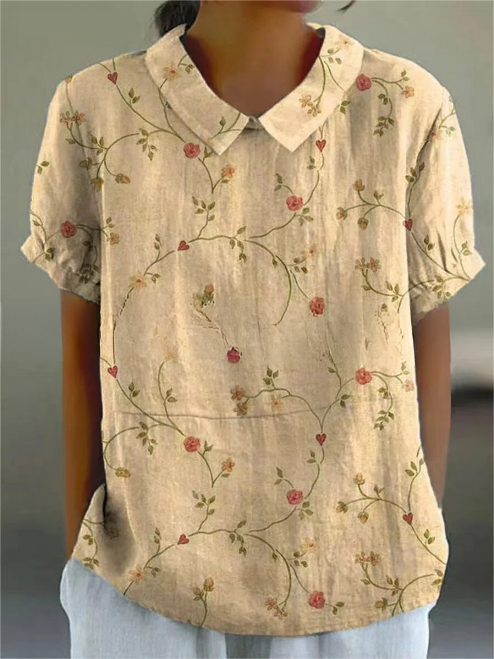 Camisa floral feminina em tecido leve, estilosa para verão. Peça essencial para moda primavera.