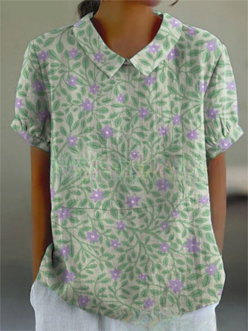 Blusa floral feminina casual, com estampa vibrante. Confortável e moderna para o dia a dia.