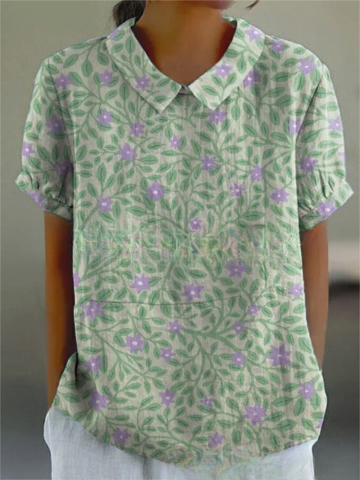 Blusa floral feminina casual, com estampa vibrante. Confortável e moderna para o dia a dia.