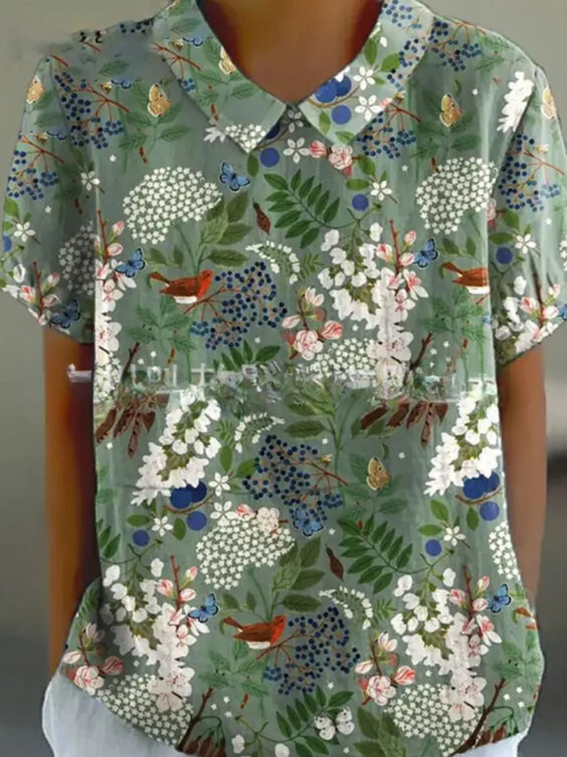 Camisa feminina floral elegante, perfeita para um look de primavera. Tecido leve e macio.