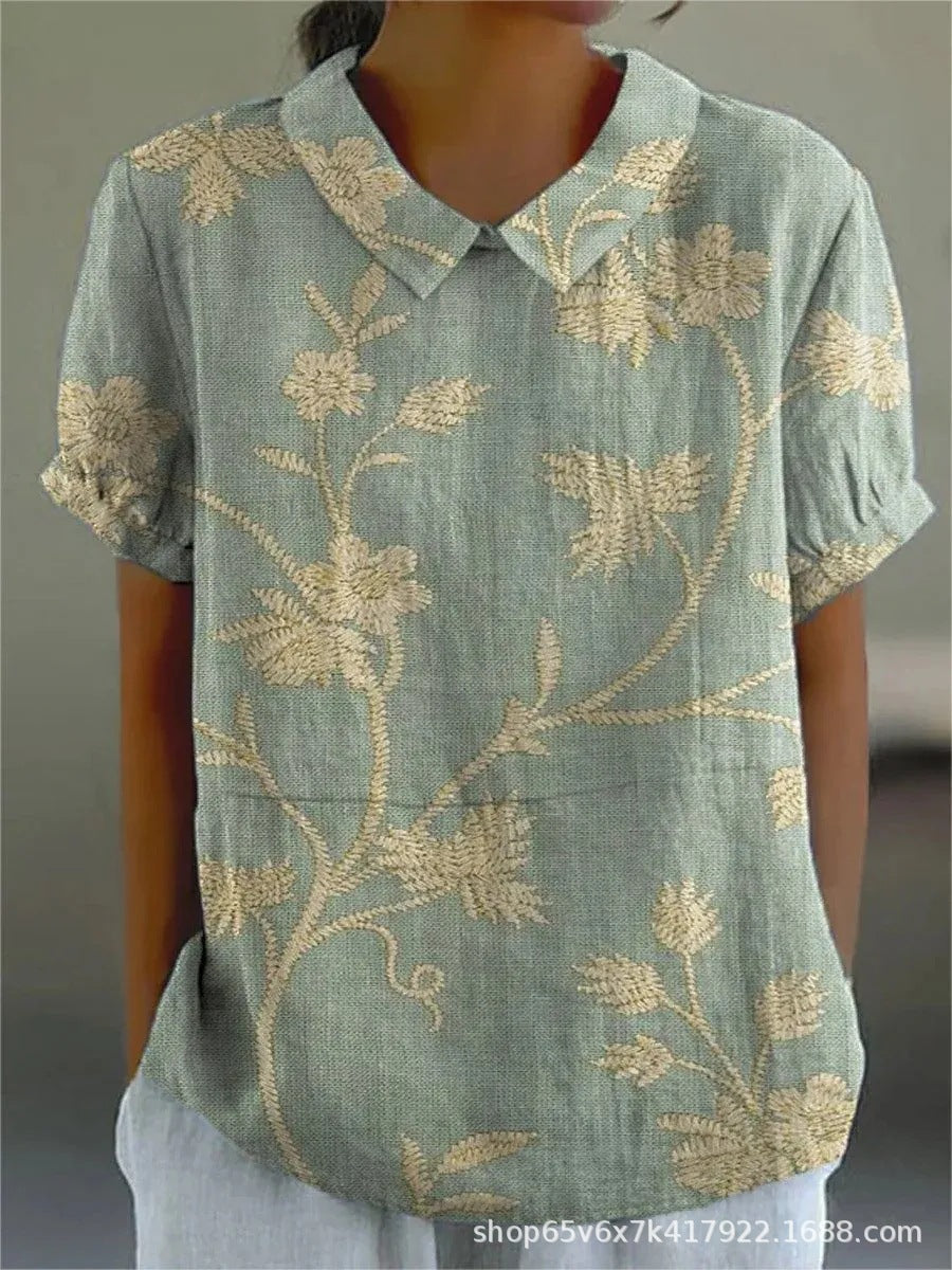 Camisa feminina floral leve, perfeita para primavera/verão. Estampa vibrante para um look casual chic.