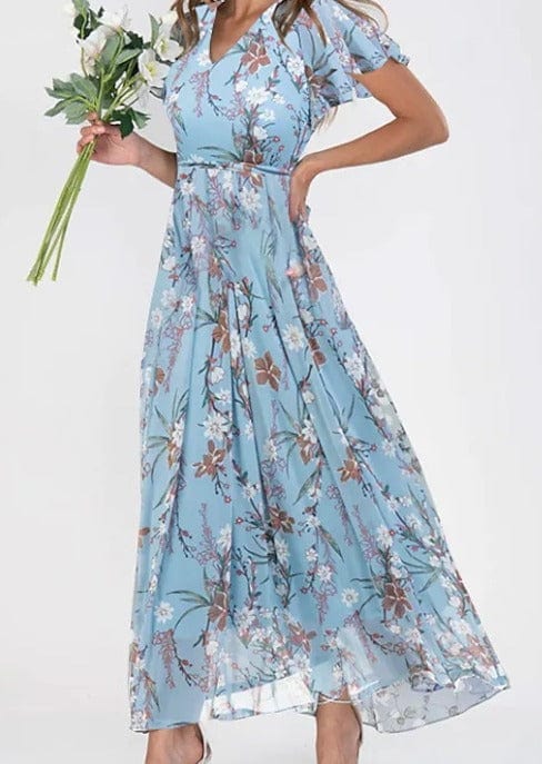 Vestido feminino fluido de verão, em cores vibrantes. Roupa casual e elegante para dias quentes.