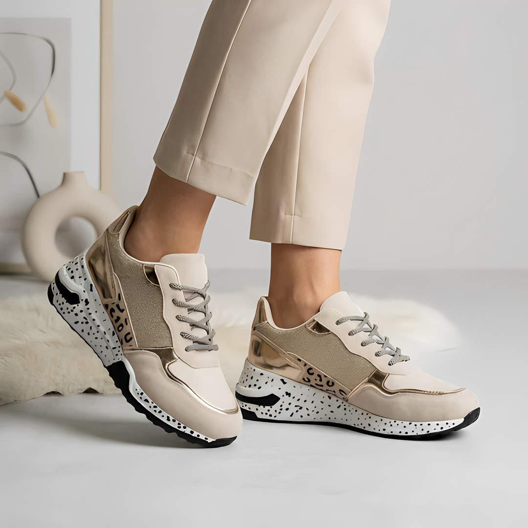 Tênis feminino Jiziel moderno e leve para o dia a dia, caminhada, com conforto e estilo casual em dourado ou prata.