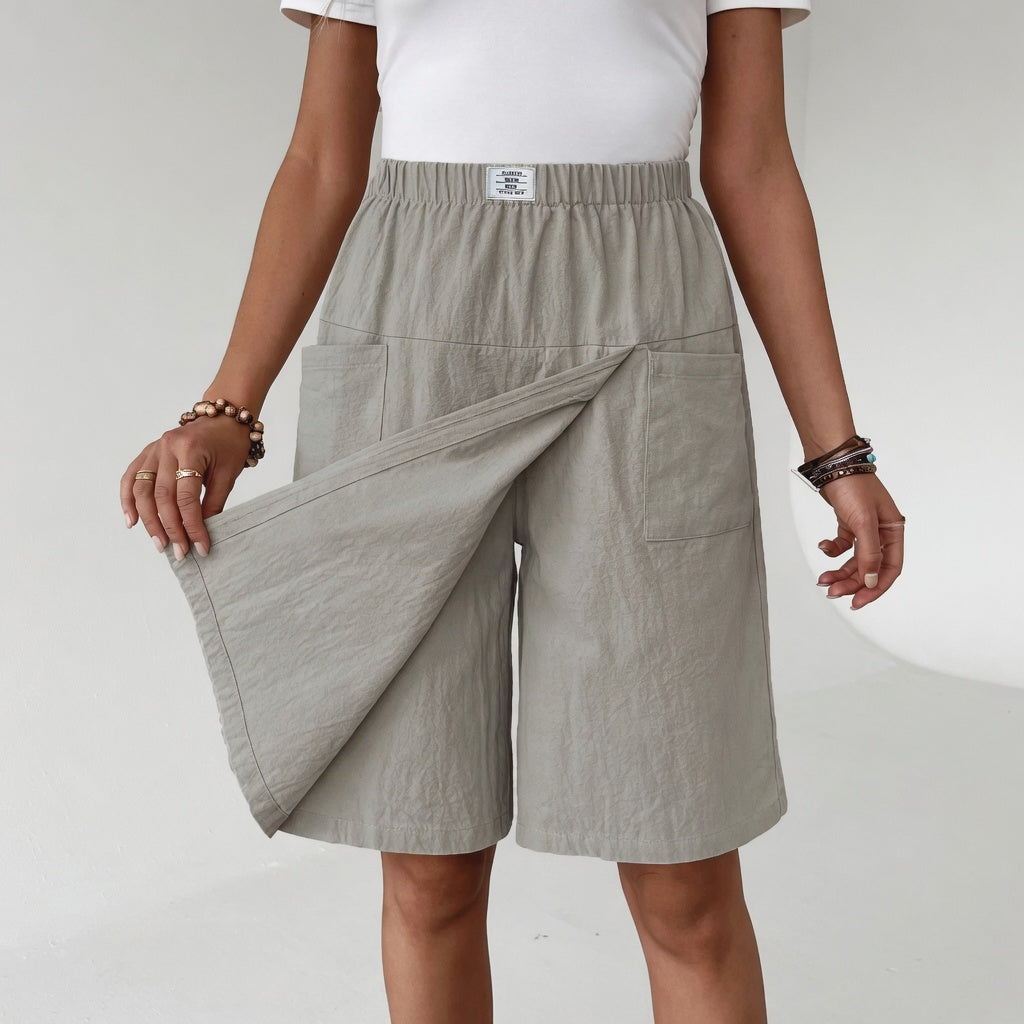 Saia-calção feminina envolvente com cintura elástica e bolso. Ideal para conforto diário e estilo casual de verão.