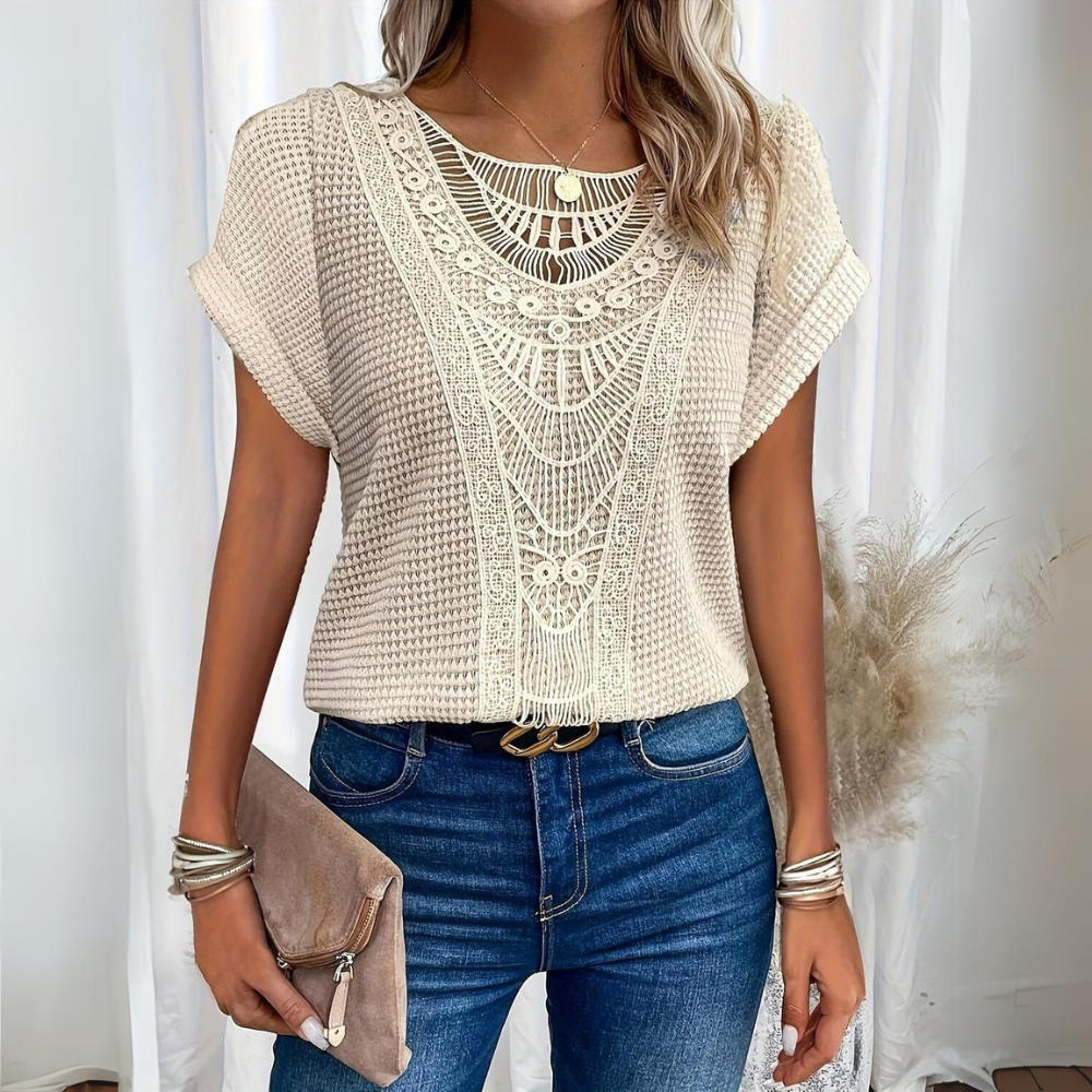 Blusa feminina elegante com detalhes delicados, perfeita para moda social e estilo moderno.