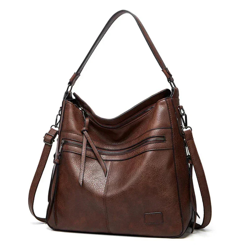 Bolsa de couro feminina, alça ajustável e transversal. Versatilidade e estilo em um acessório de luxo.
