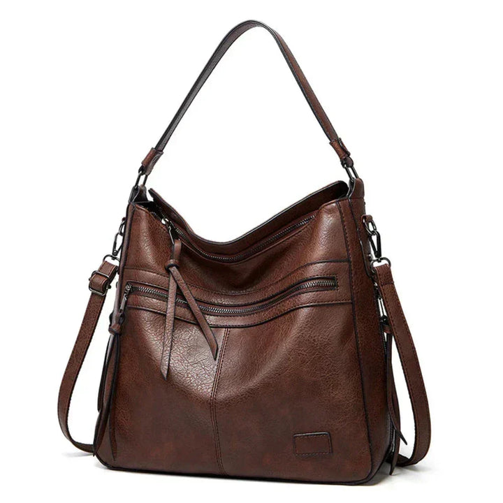 Bolsa de couro feminina, alça ajustável e transversal. Versatilidade e estilo em um acessório de luxo.