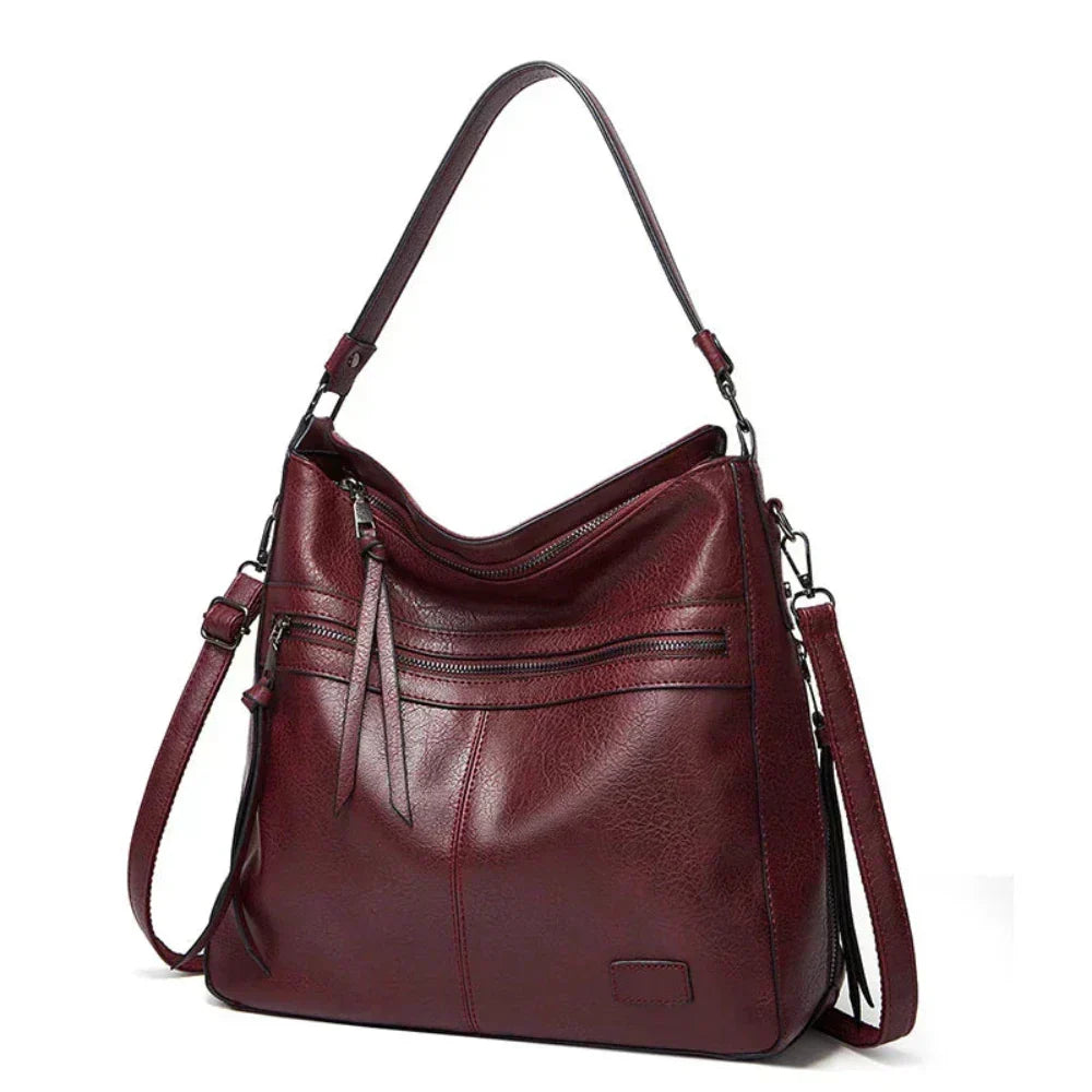 Bolsa feminina de luxo em couro genuíno, disponível em várias cores. Acessório elegante e moderno.