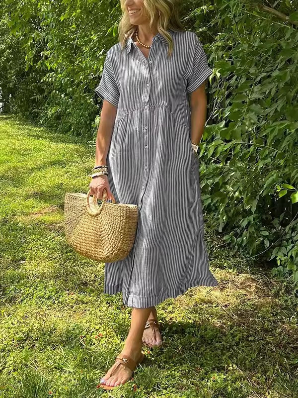 Moda feminina: Vestido longo de verão fluido, com manga curta e cores vibrantes, ideal para praia.