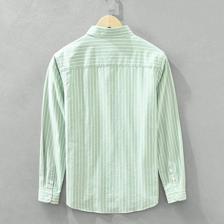 Blusa feminina listrada para moda praia, verão e estilo casual. Design elegante, leve e confortável.