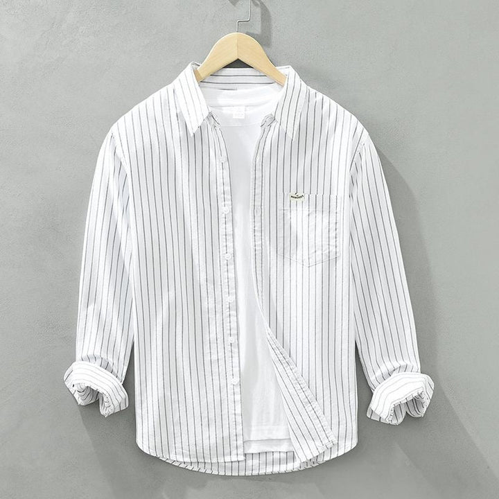 Blusa feminina listrada, ideal para o verão e praia. Estilo casual e elegante, com cores vibrantes.
