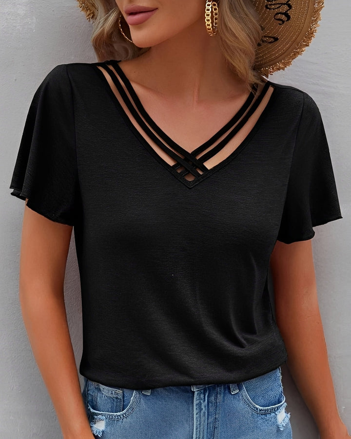 Top feminino elegante com babados para primavera/verão. Blusa confortável e versátil, perfeita para o dia a dia.