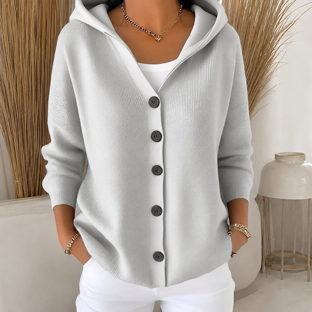 Cardigã feminino com capuz e manga comprida, peça versátil para um look casual e aconchegante.