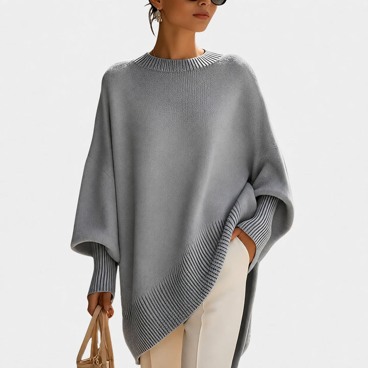 Pulôver feminino oversize estiloso, tendência de moda para inverno, oferece conforto e toque casual.