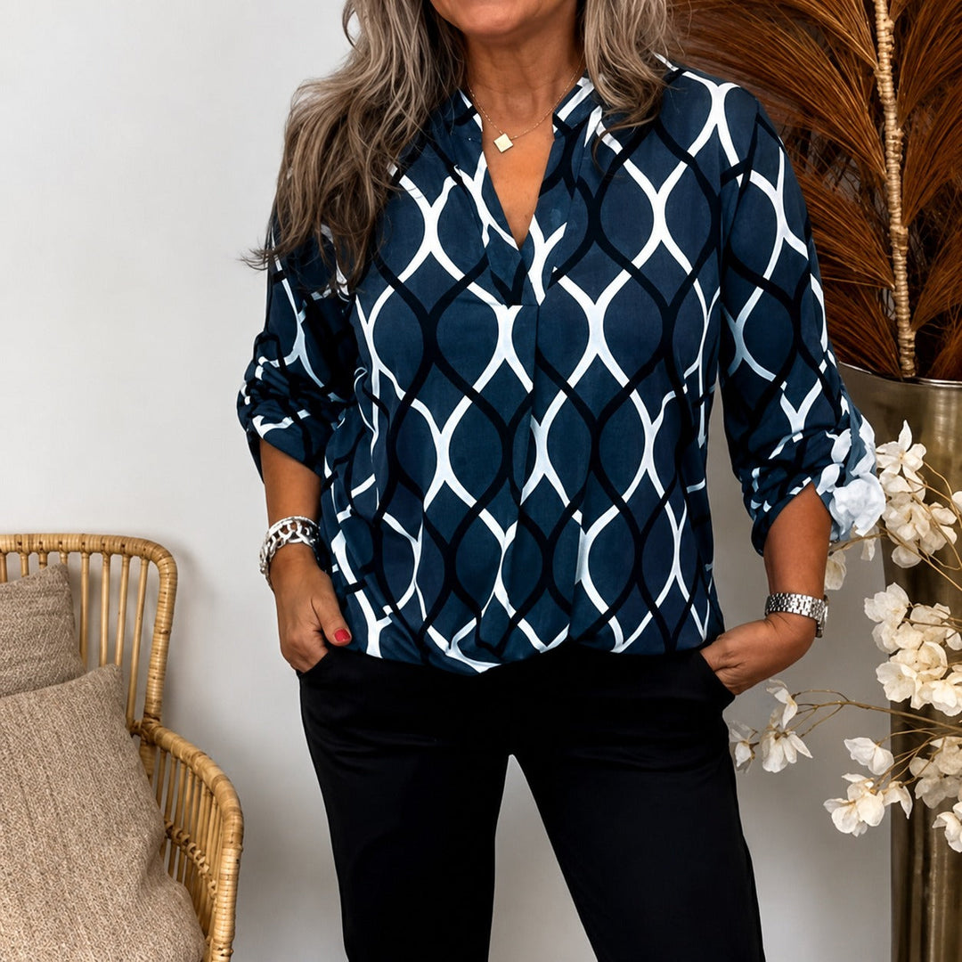 Blusa feminina solta de manga longa para outono/primavera, oferecendo conforto e estilo casual versátil.