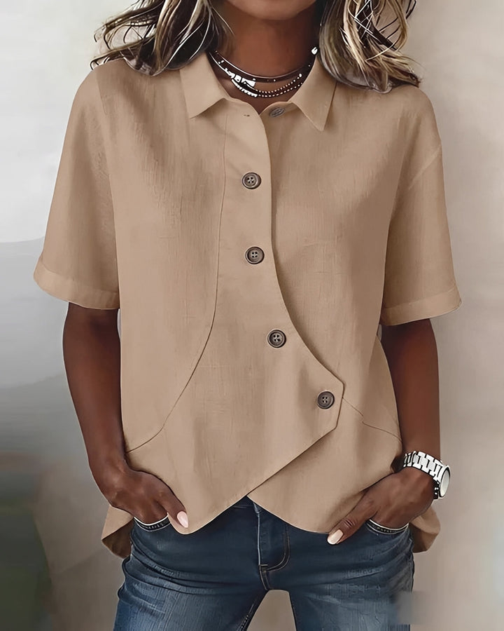 Blusa assimétrica feminina com botões, um toque de elegância moderna para seu guarda-roupa versátil.