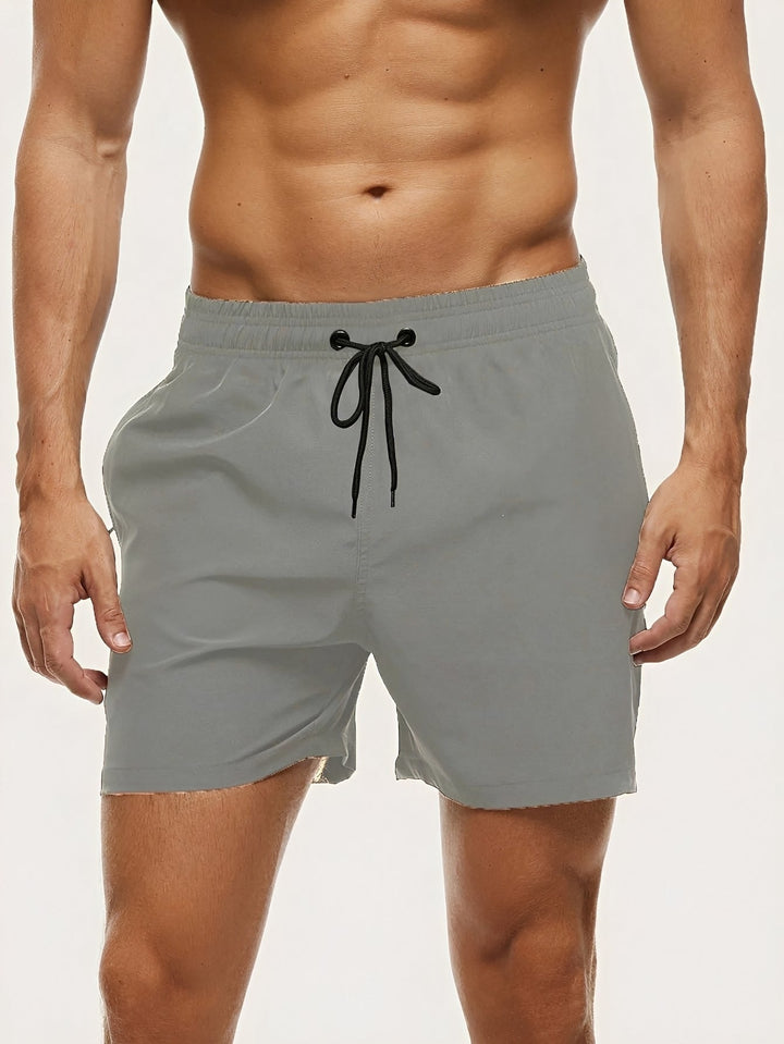 Essenciais calções de banho masculinos para o verão. Secagem rápida e conforto para dias na praia ou piscina.