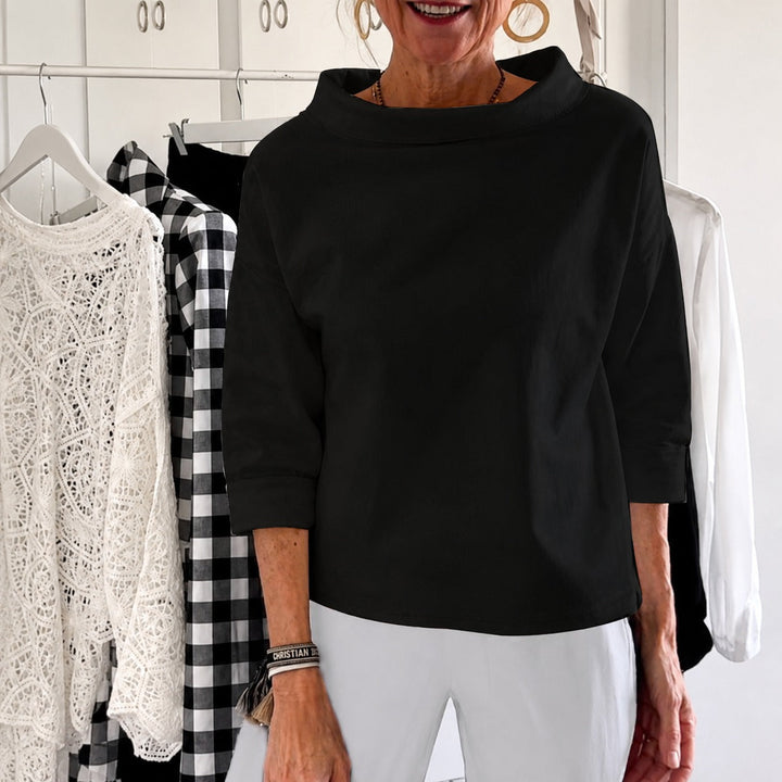 Blusinha feminina versátil com gola alta, casual ou formal. Peça curinga para seu guarda-roupa, puro conforto.