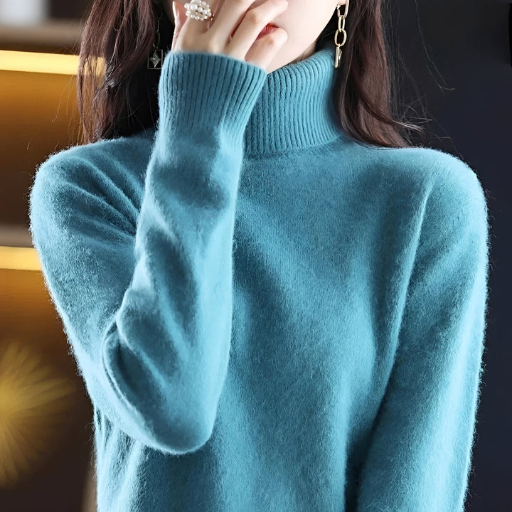 Suéter feminino chic de inverno, com gola alta para um estilo elegante e confortável.