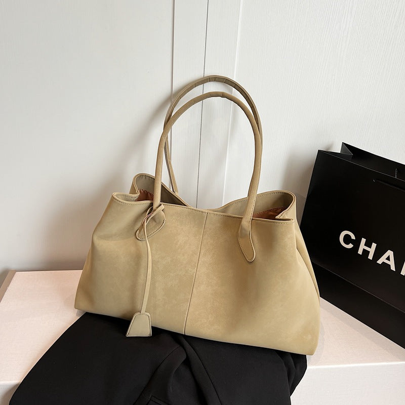 Bolsa feminina grande e funcional, perfeita para compras e uso diário.