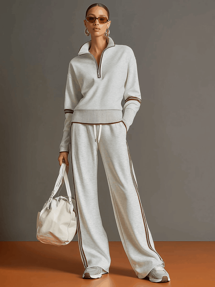 Elegante conjunto de roupa feminina com blusa e calças soltas, ideal para conforto diário.
