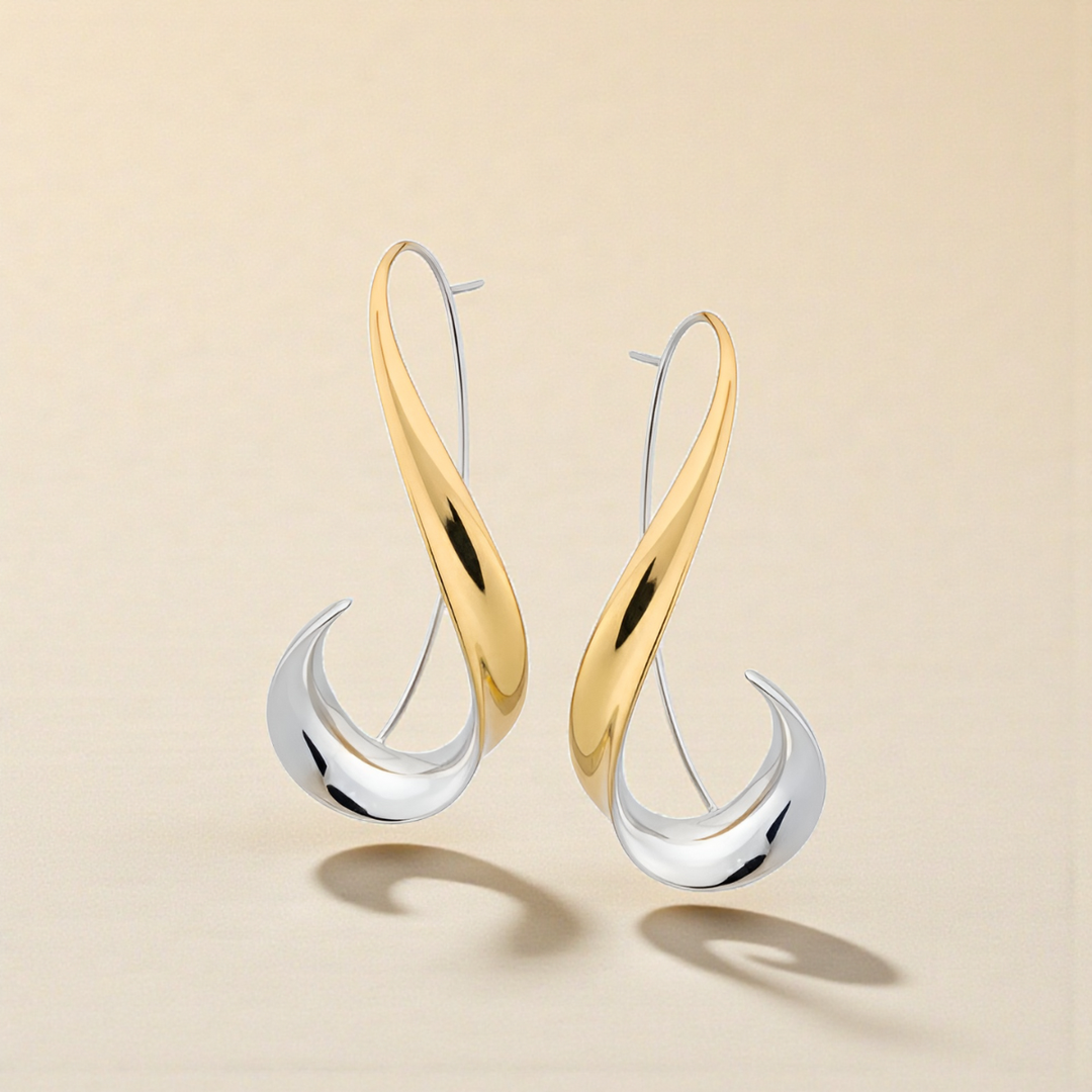 Joias femininas: brincos modernos pendentes em prata e dourado. Acessório sofisticado para um toque de elegância.
